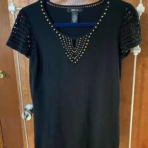 Flattering black top, gold studs, crochet sleeves